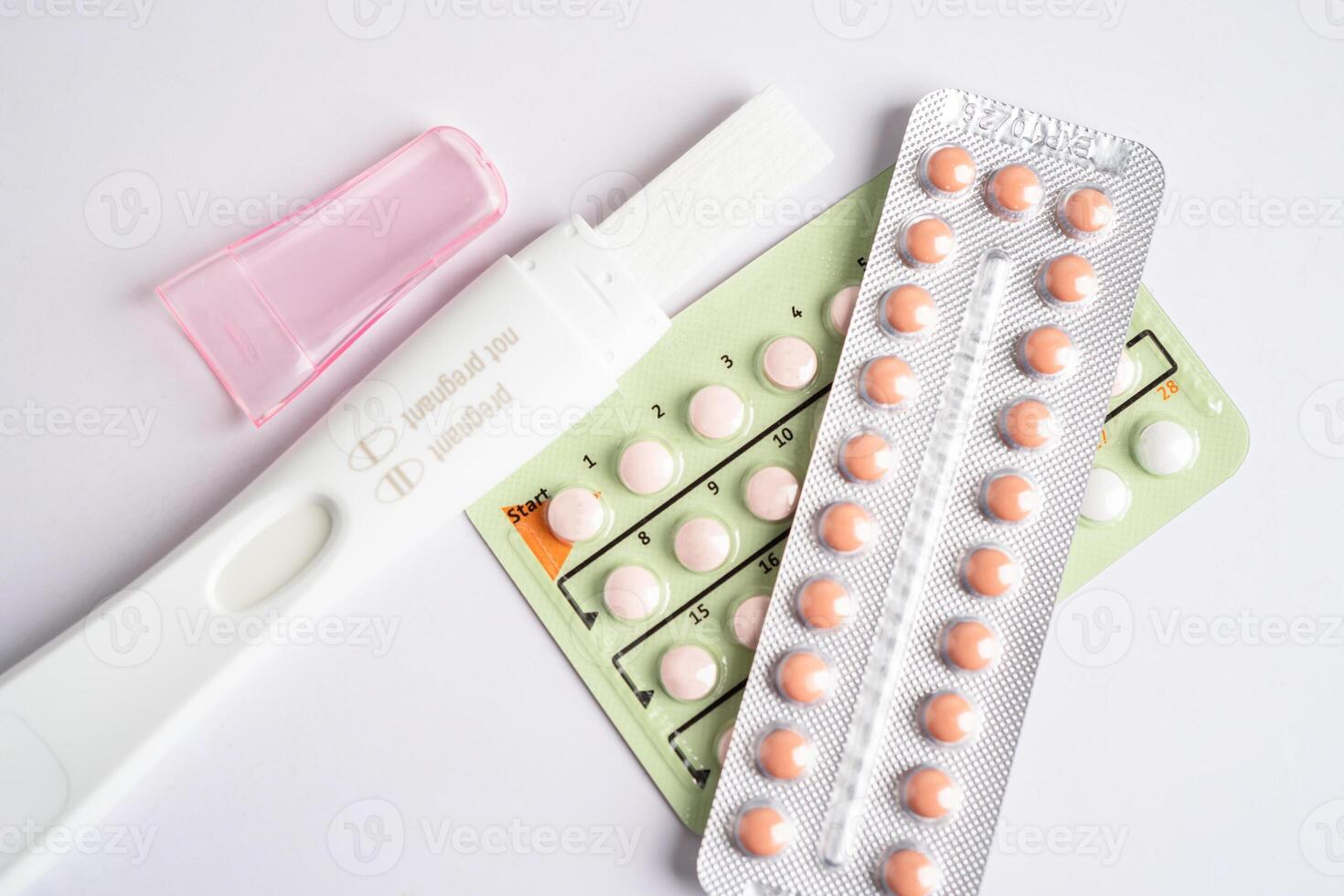 Pregnancy test and birth control pills, contraception health and medicine. photo
