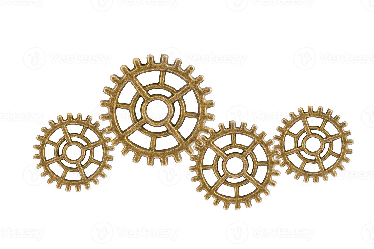 Gear and cogs wheels isolated on a white background, clock mechanism, brass metal engine industrial. photo