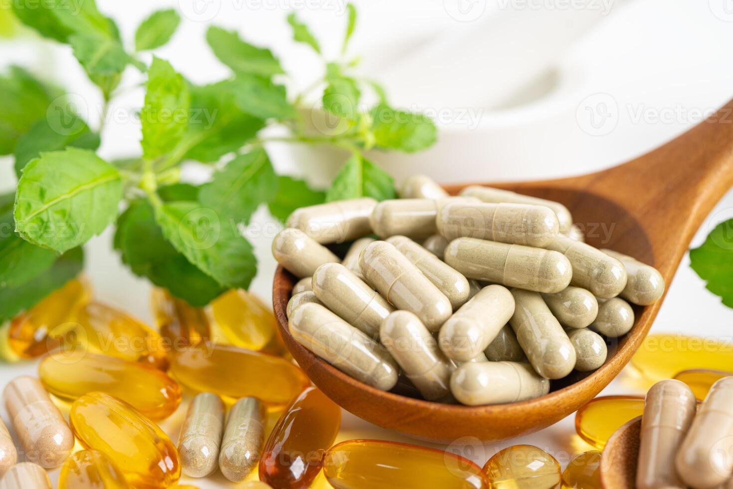 Alternative medicine herbal organic capsule with vitamin E omega 3 fish oil, mineral, drug with herbs leaf natural supplements for healthy good life. photo