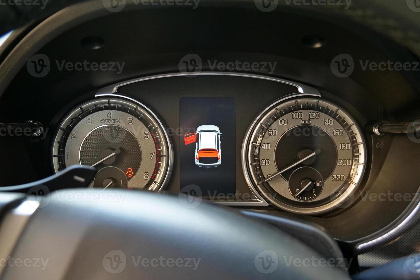 Opened Door Warning Icon Between Speedometer And Tachometer On Car Dashboard photo