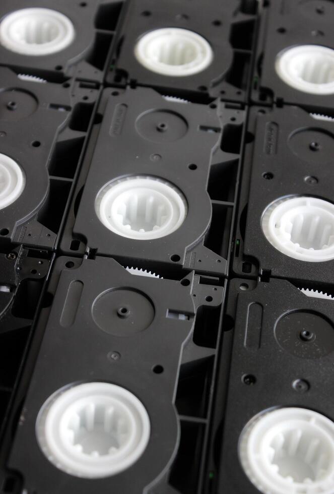 Attached close to each other rare small video cassettes textured surface photo