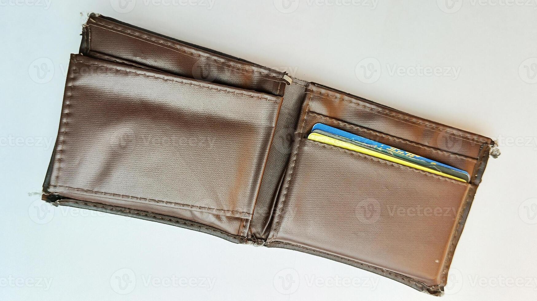 open brown leather wallet isolated on white photo