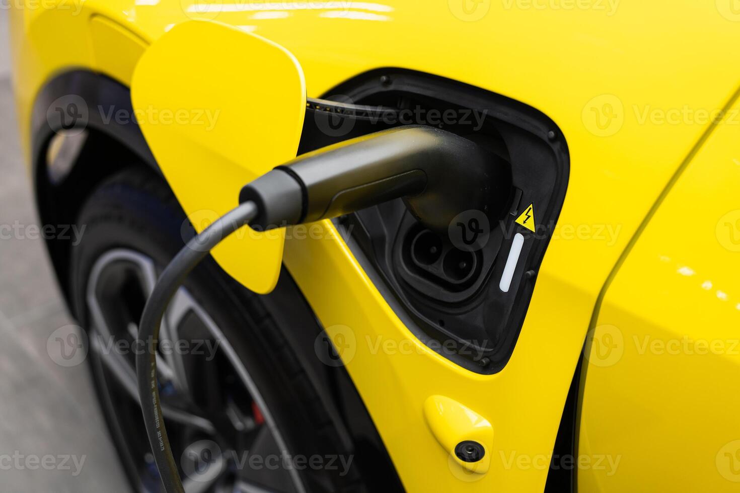 EV Car or Electric car at charging station with the power cable supply plugged. EV charging station for electric car in concept of green energy and eco power produced. photo