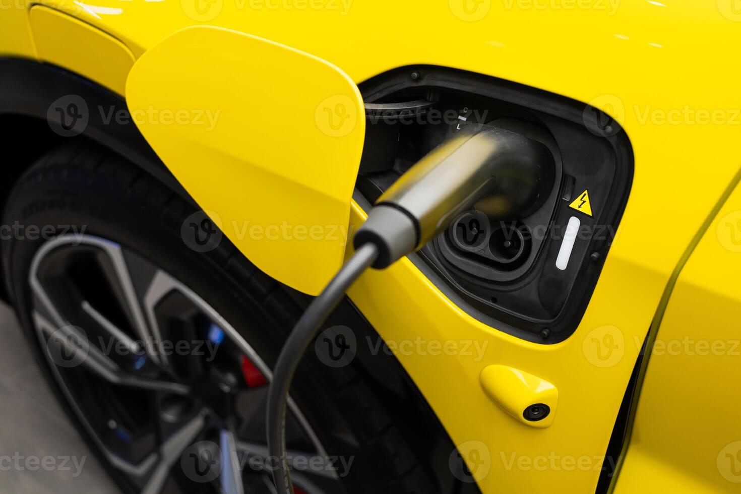 EV Car or Electric car at charging station with the power cable supply plugged. EV charging station for electric car in concept of green energy and eco power produced. photo