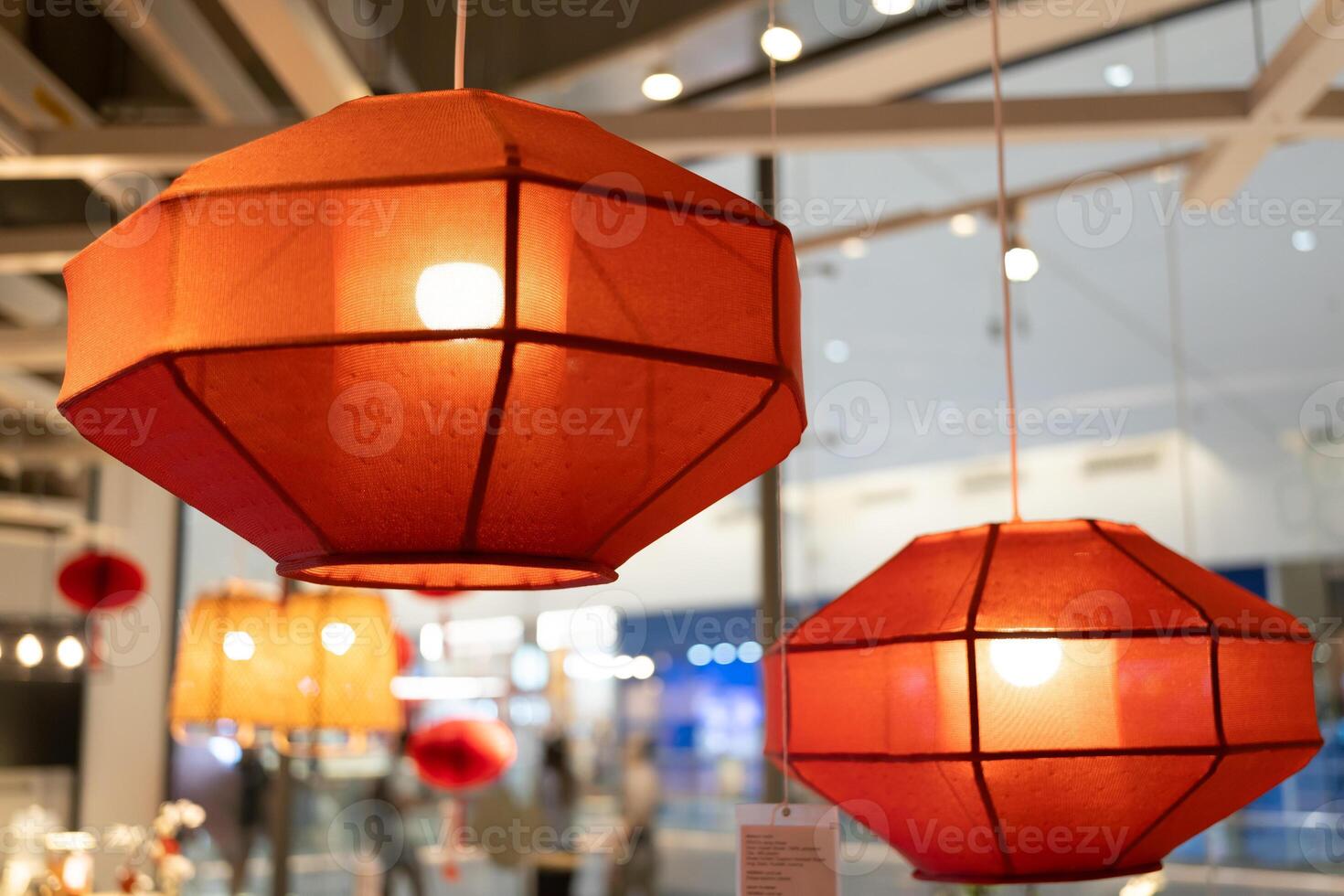 Red lamp shade. Hanging Lamp with Red Shade, Modern Chandelier with Light Bulb. photo