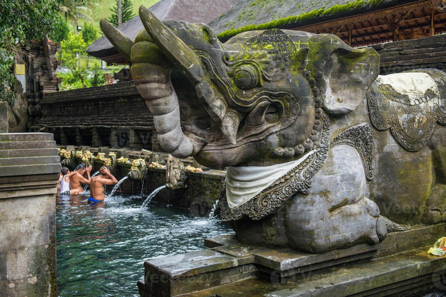 Traditional Balinese elephant statue located nearly the holy pool in Pura Tirta Empul the holy spring water temple in Bali, Indonesia. photo