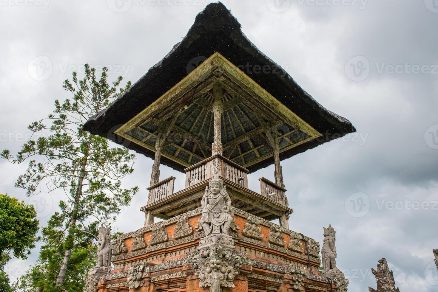 The spiritual shrine in Pura Taman Ayun the royal temple of Mengwi empire in Badung Regency, Bali, Indonesia. View in the Cloudy day. photo