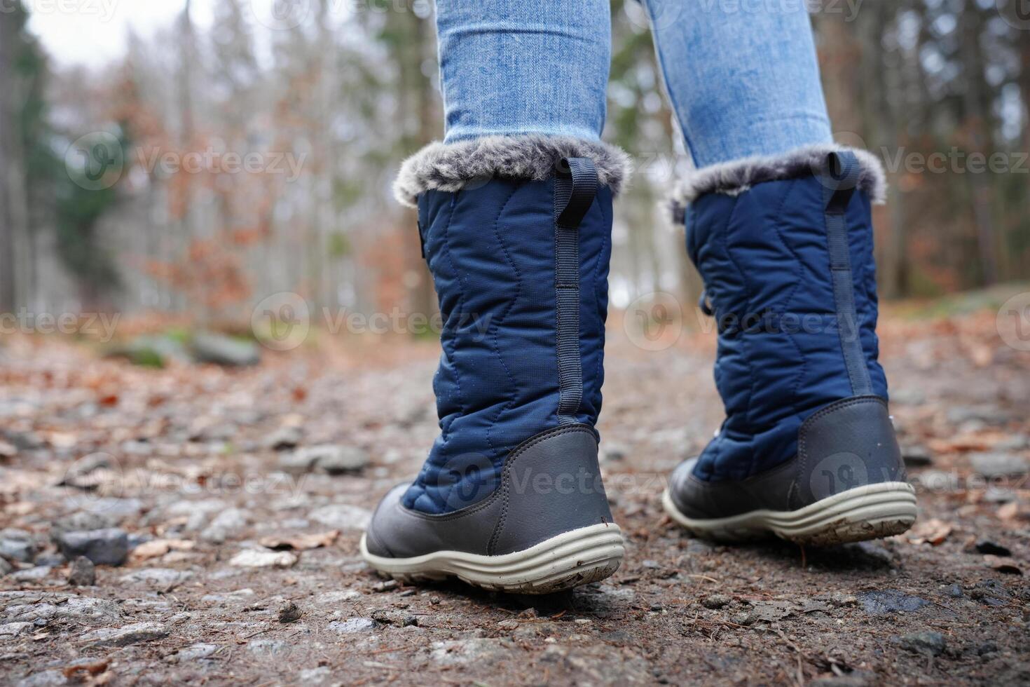 Rear view of traveler in hiking boots photo