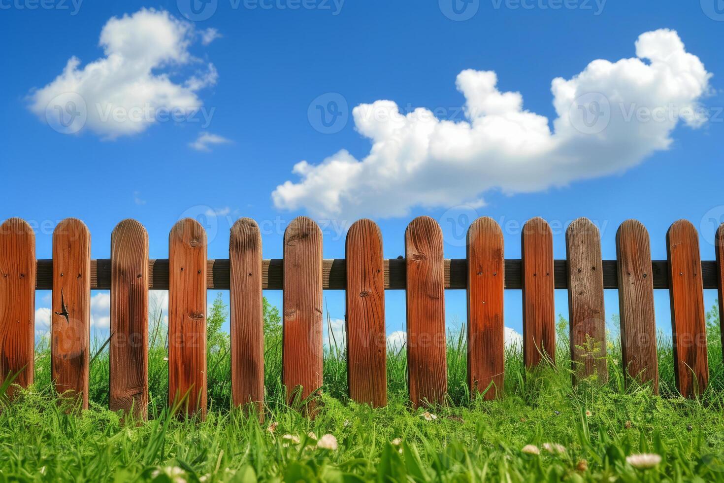 AI generated Garden fence with green grass and blue sky. photo