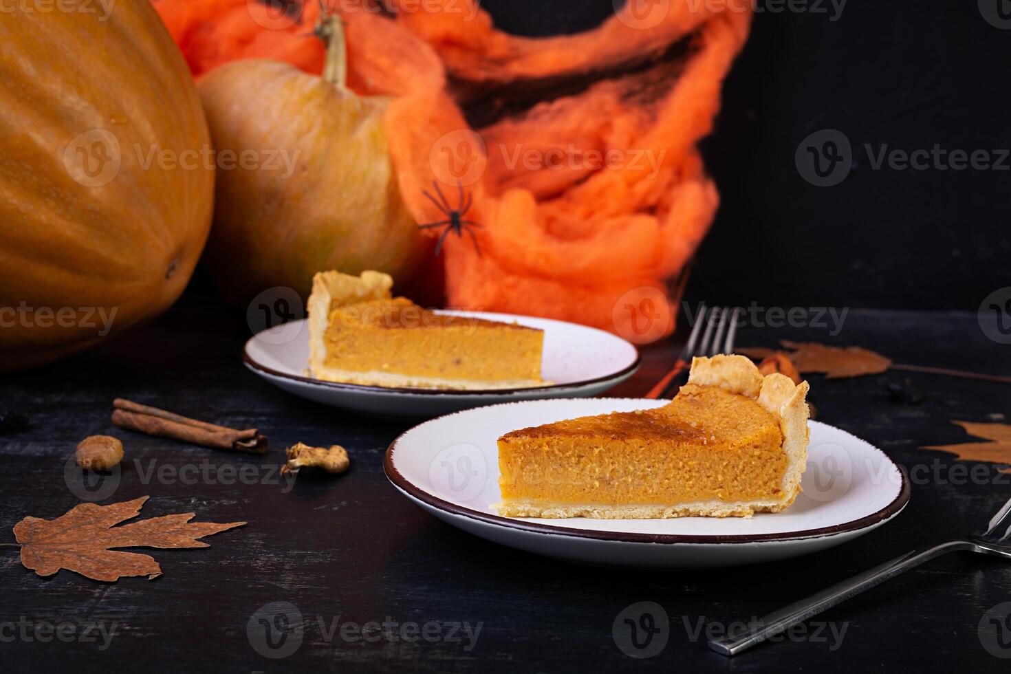 Pumpkin tart for autumn holidays. American pumpkin pie. Halloween background. photo