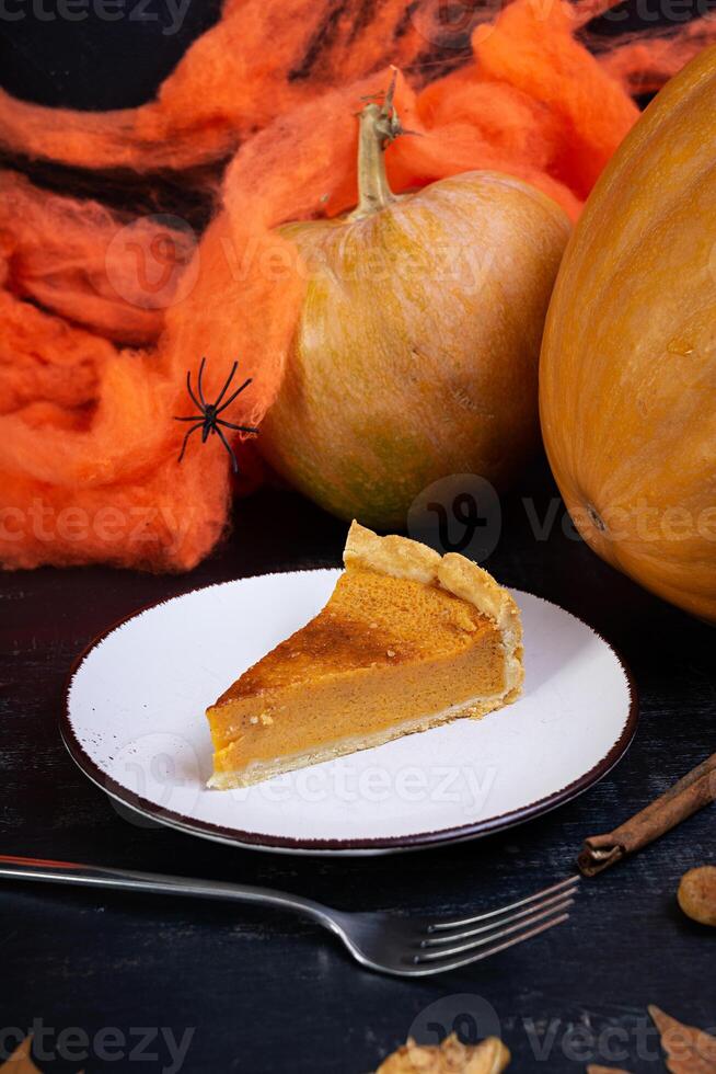 Pumpkin tart for autumn holidays. American pumpkin pie. Halloween background. photo