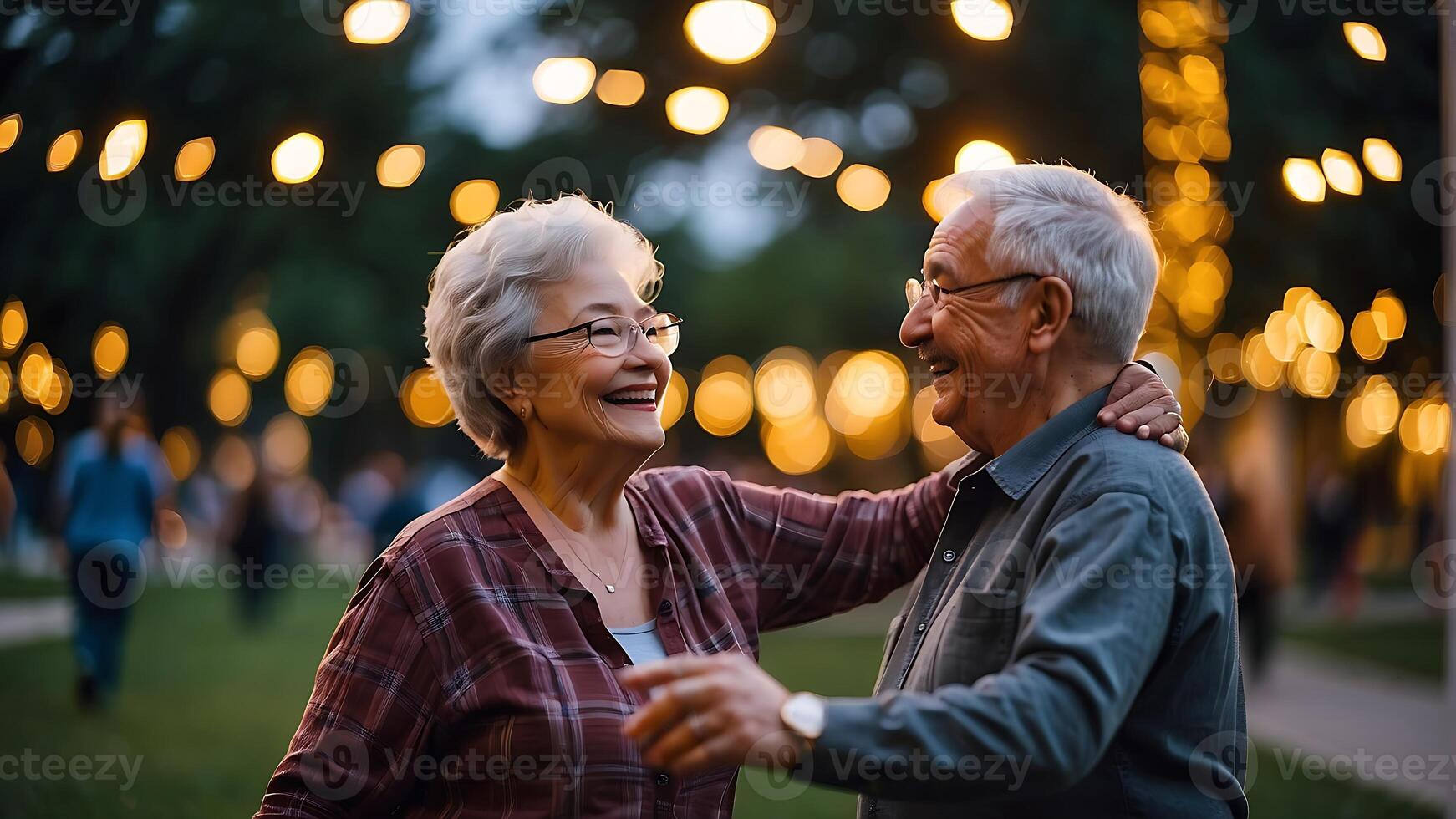 AI generated a couple of grandparents are dancing in the park with a background of bokeh light photo