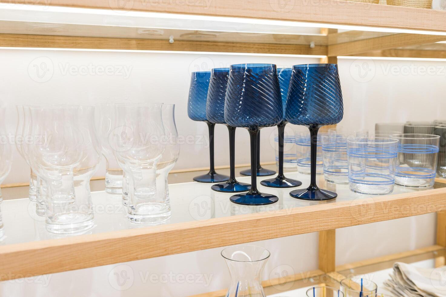 Elegant Blue Stemware and Clear Glasses photo