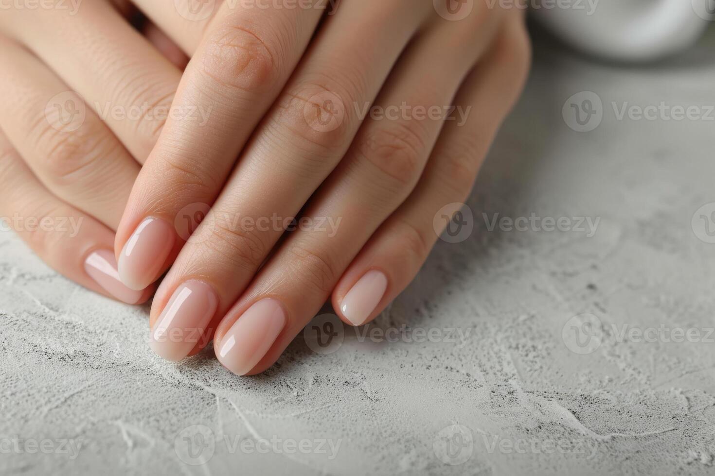 AI generated Elegant Manicured Hands on Marble photo