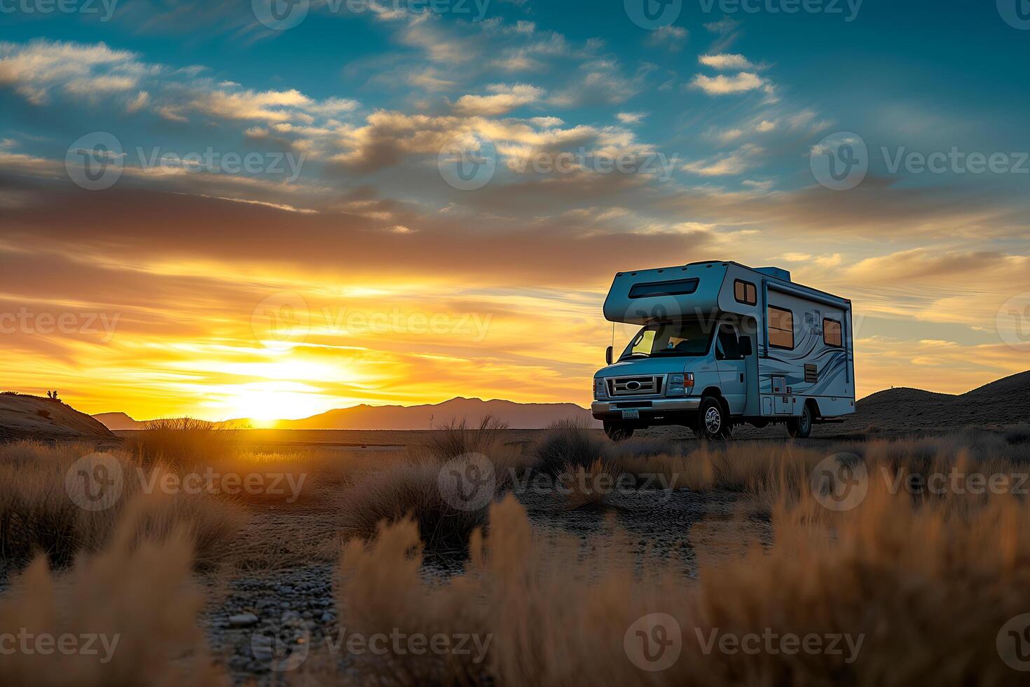 AI generated In the heart of the desert, an RV camper is silhouetted against a stunning sunset, the sky ablaze with gold and orange, inviting an evening of peaceful solitude photo