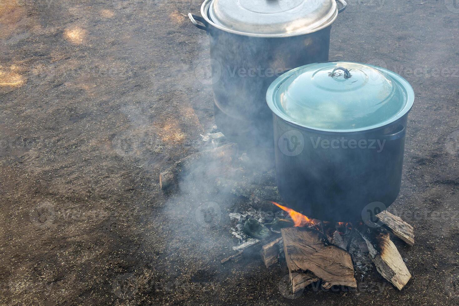 Cooking in pots in the field with firewood in Mexico photo