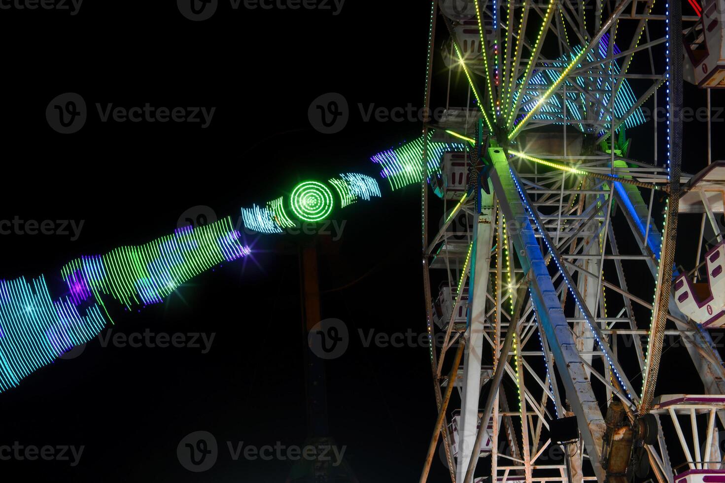 Mexican fair with rides and lights at night, with space for text photo