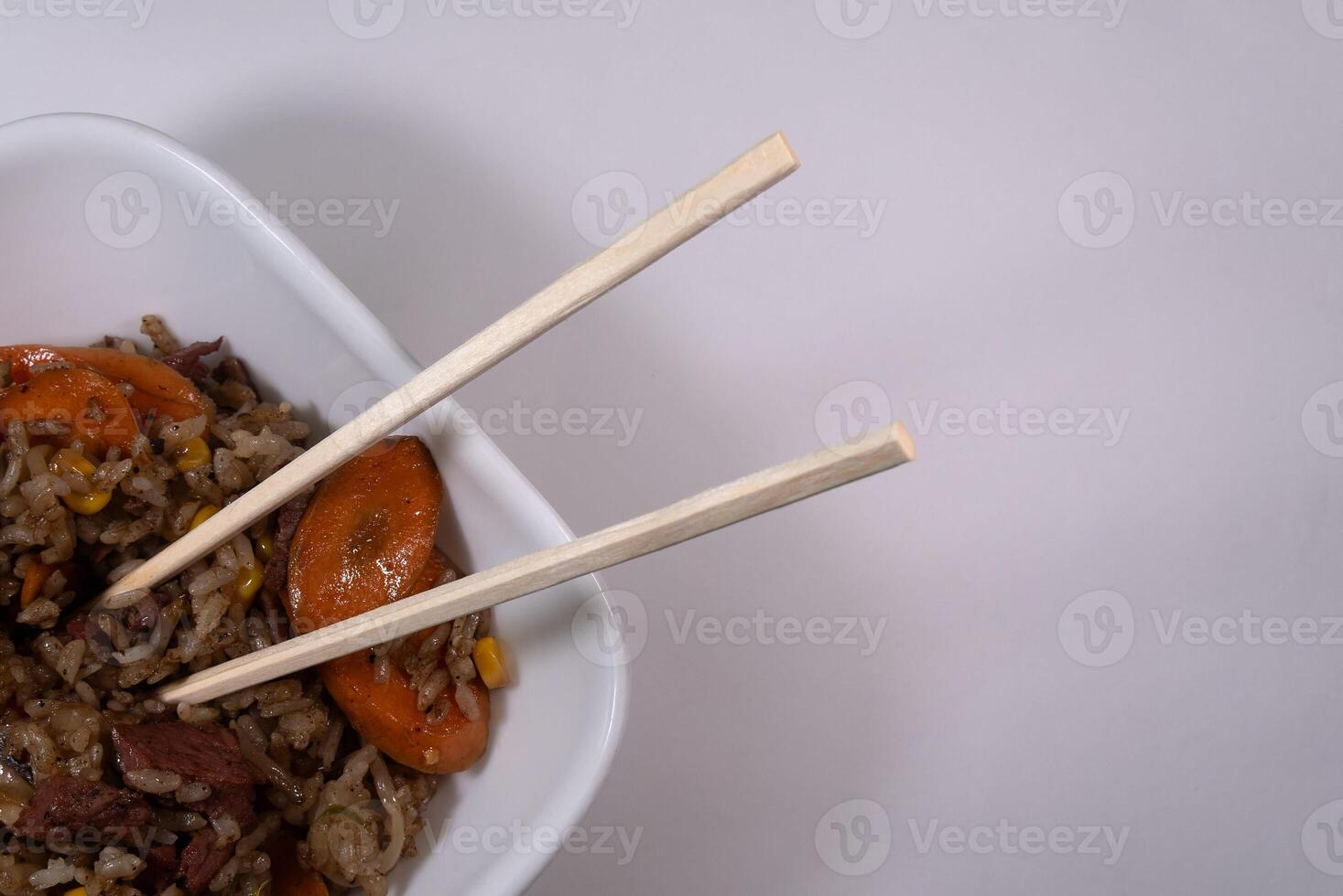 Freshly made Chinese fried rice with meat and vegetables, with space for text photo