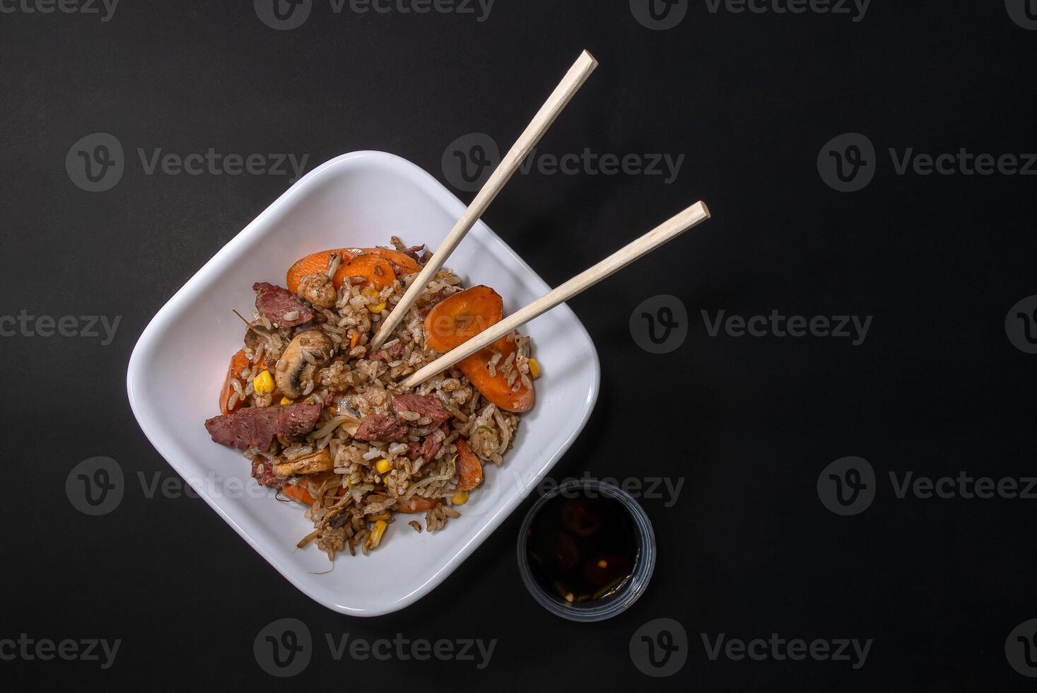 Freshly made Chinese fried rice with meat and vegetables, with space for text photo