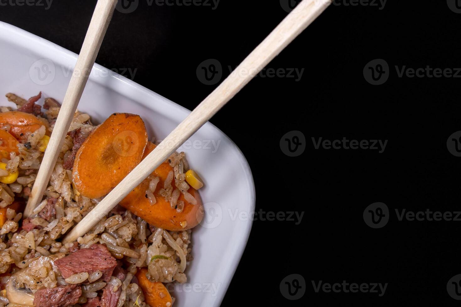 Freshly made Chinese fried rice with meat and vegetables, with space for text photo