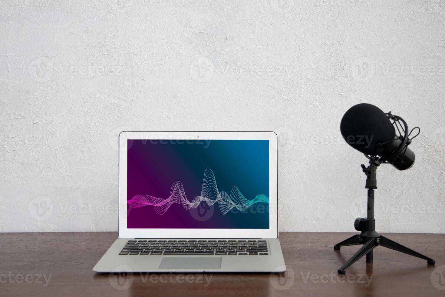 Laptop computer with condenser microphone for small home sound voice studio radio podcast concept photo