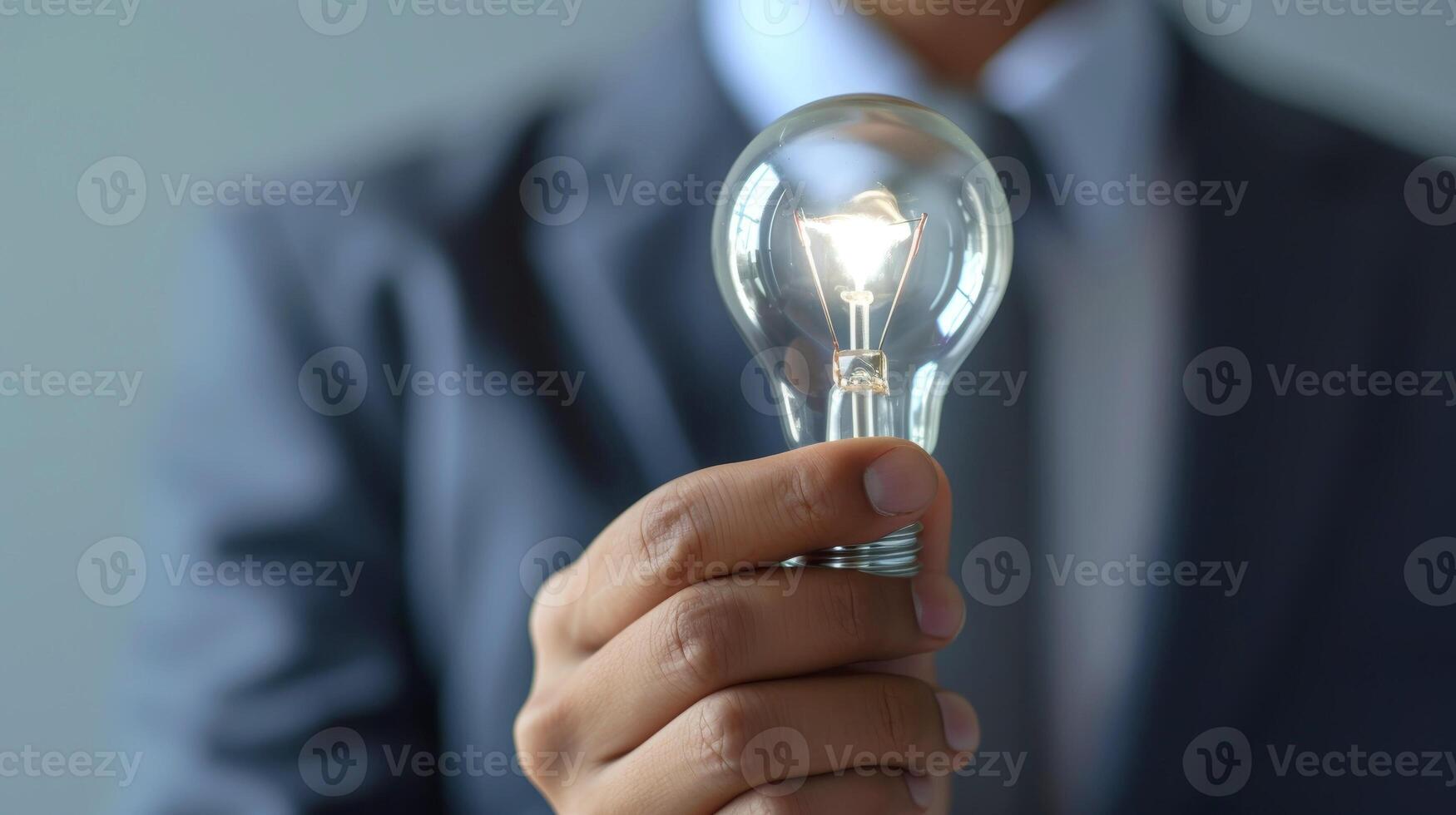 AI generated Close-up, Hand of businessman holding illuminated light bulb, idea, innovation and inspiration concept, Generative AI photo