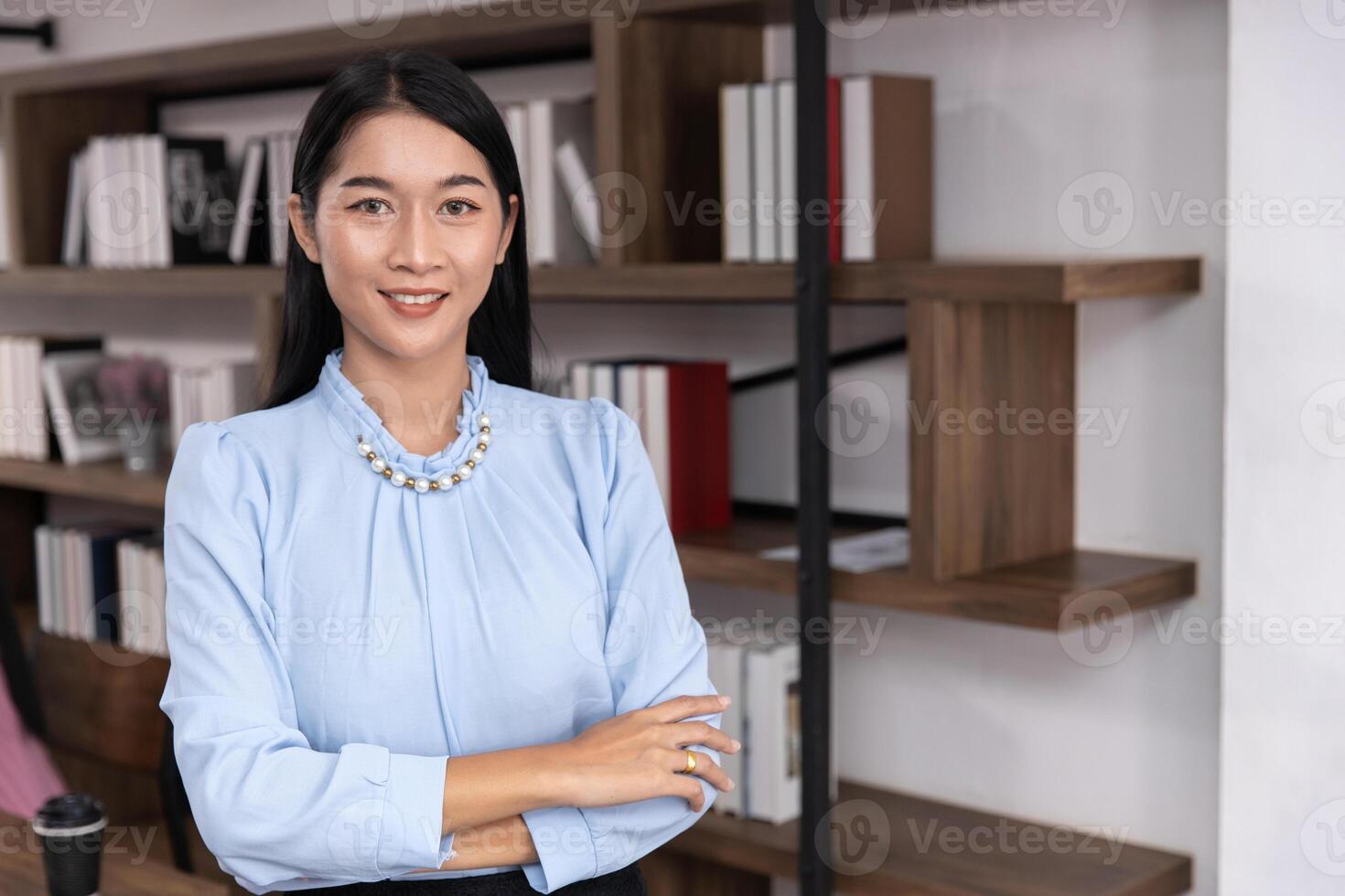 portrait asian success business woman leader confident arm crossing happy smile in office photo