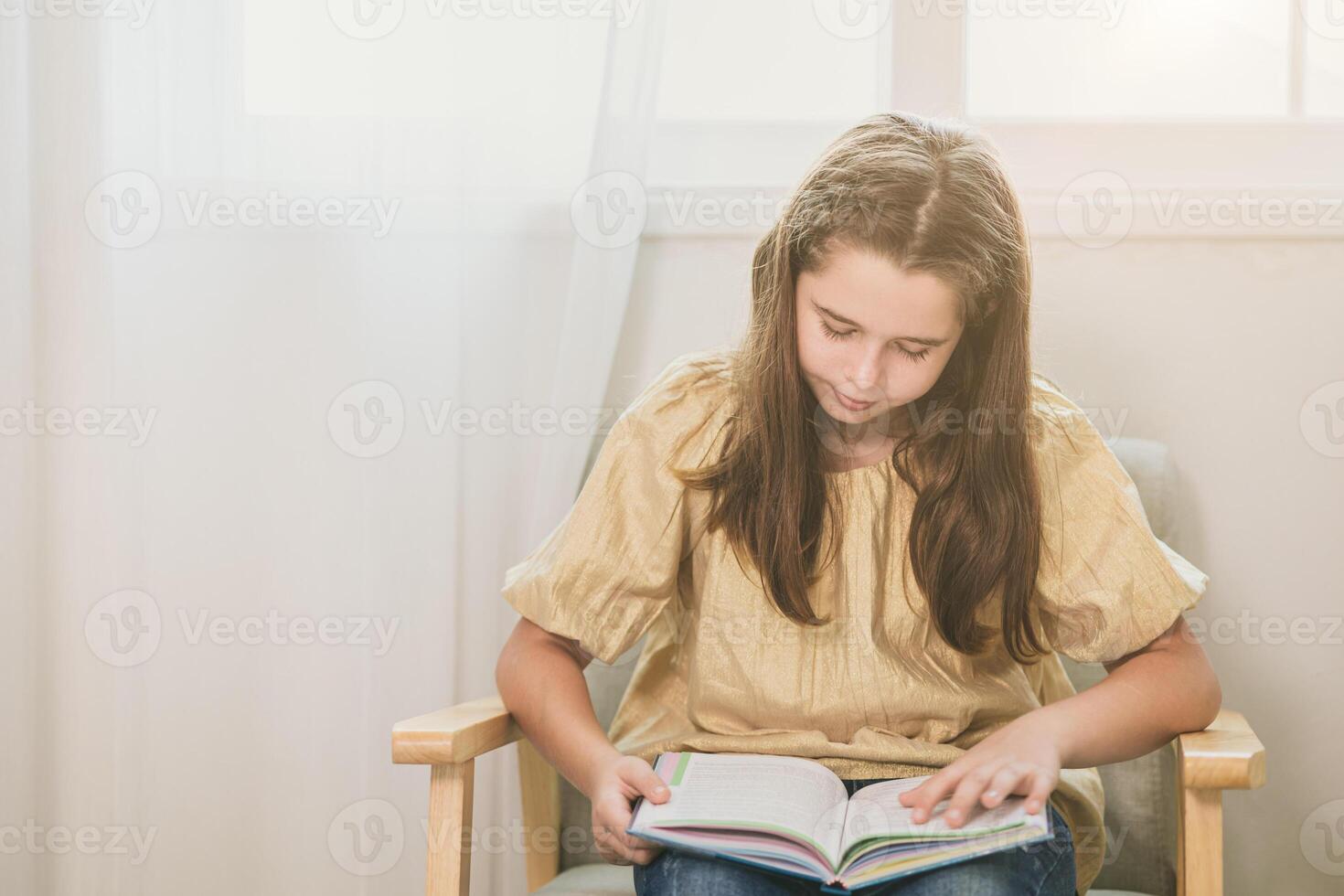 cute child girl reading a book at home for bookworm nerdy smart kid learning self education photo