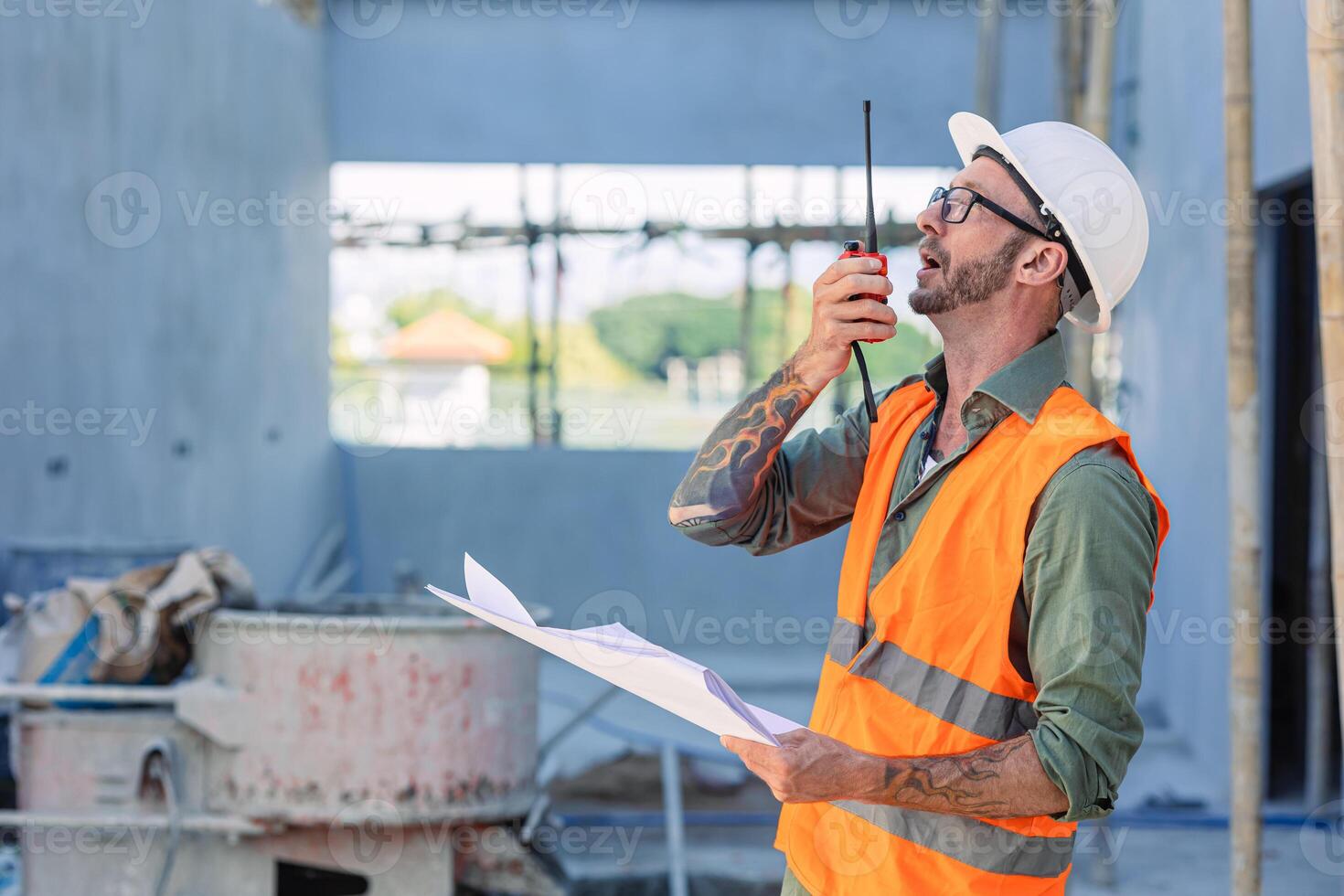 Engineer builder foreman work radio call in construction site. Architect worker project designer leader concept. photo