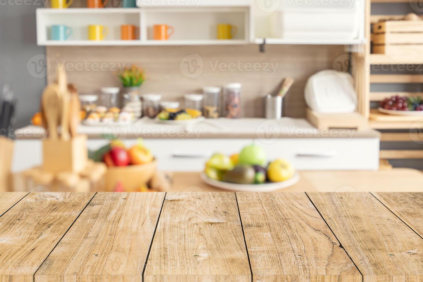 Wood table top with blur kitchen counter decoration for montage product display. background for cooking food layout concept. photo