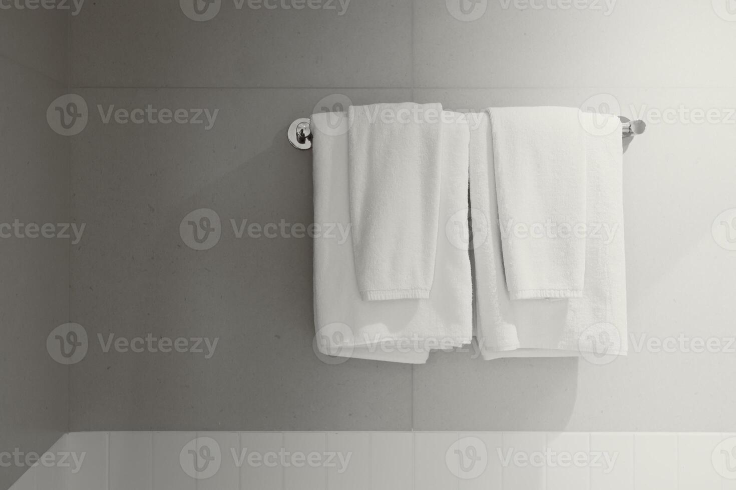 Towel white clean new rack hanging shower room service in hotel bathroom photo