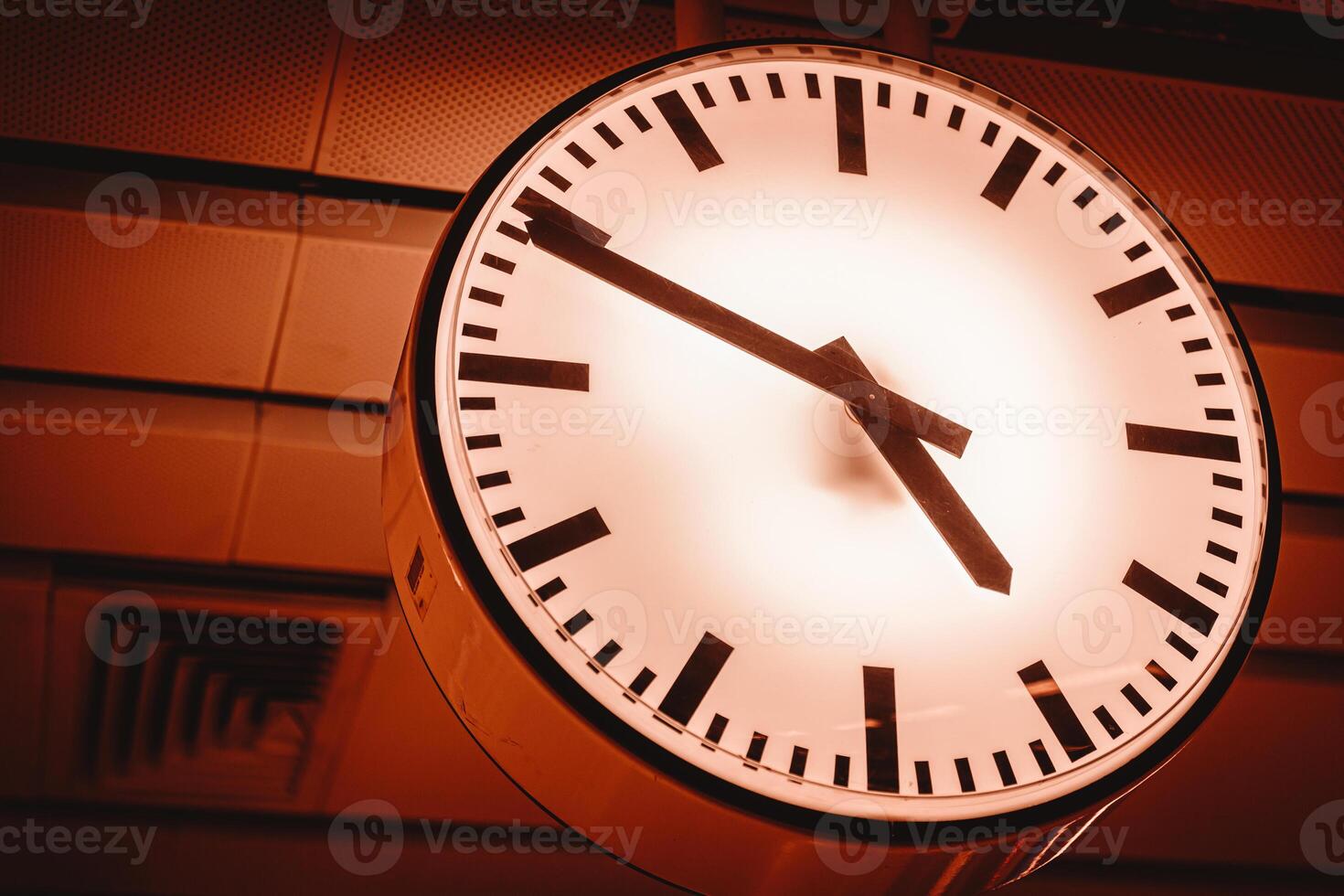 city public clock time at transport station for timing business schedule hurry lifestyle red color photo