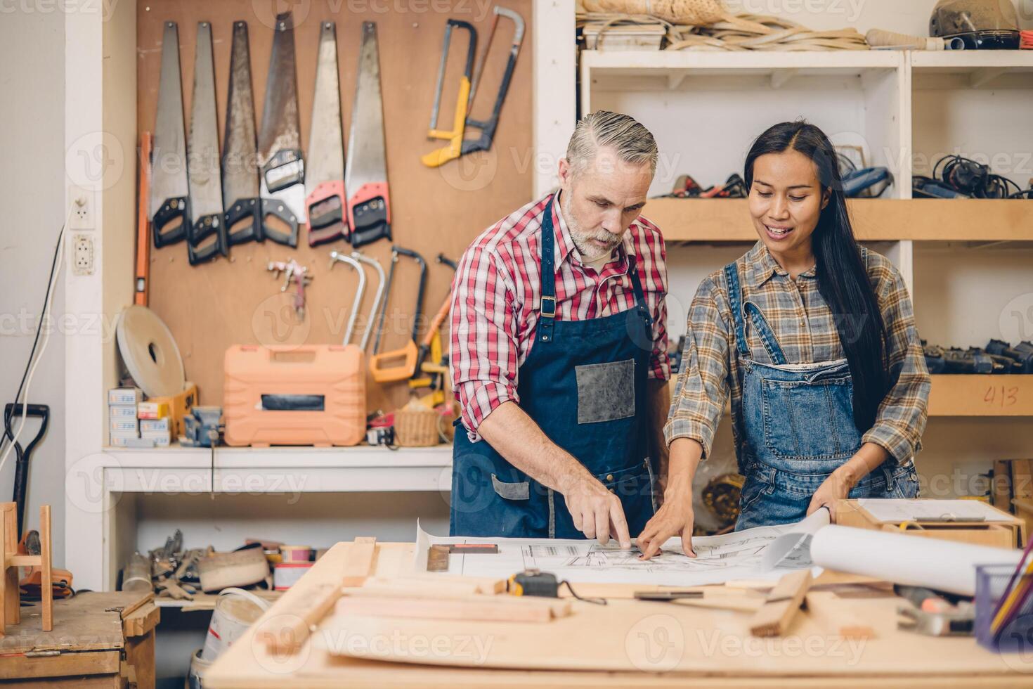 wood workshop worker working together home renovate plan project discussion photo