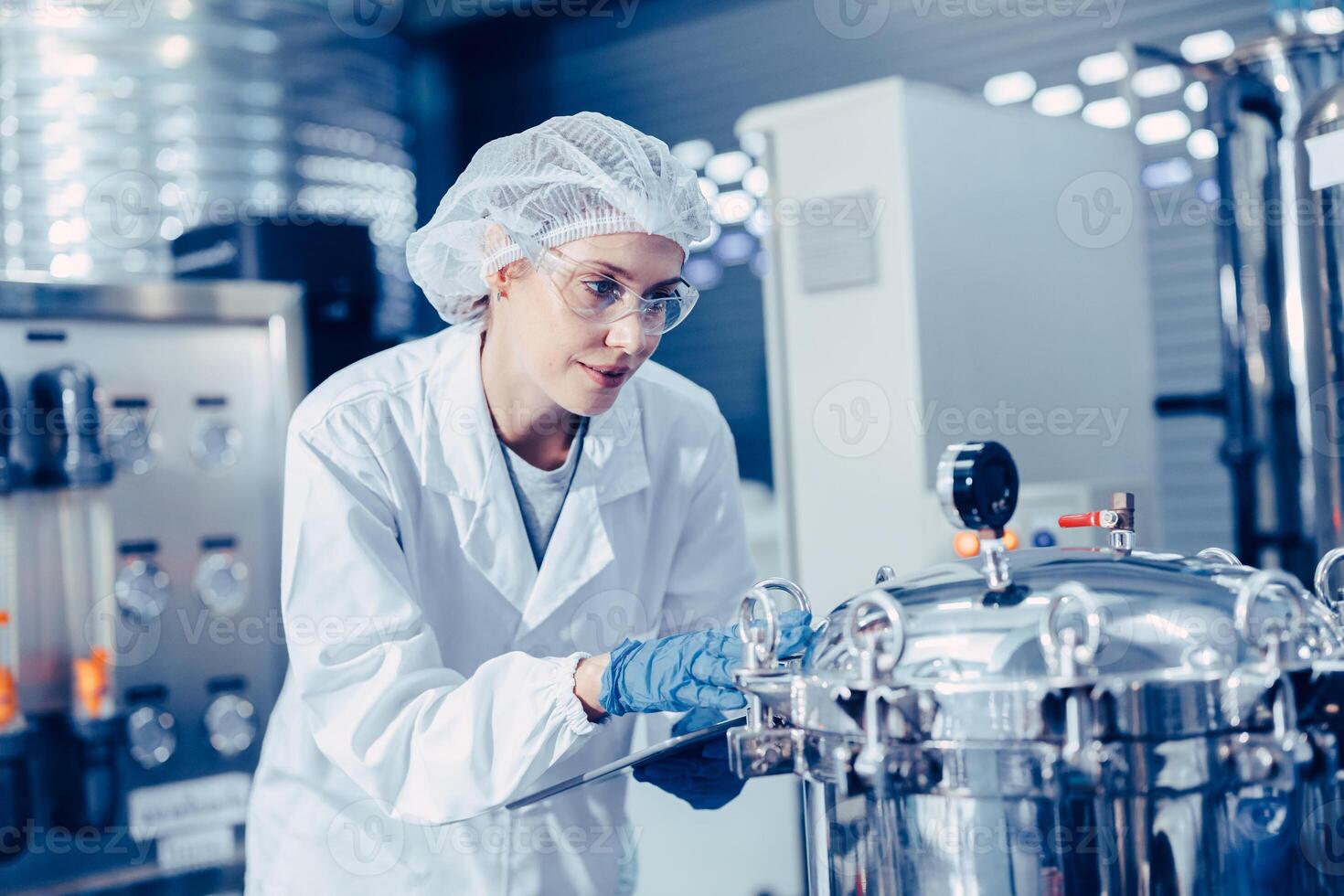 staff work in science medical lab factory check record pressure tank happy working photo