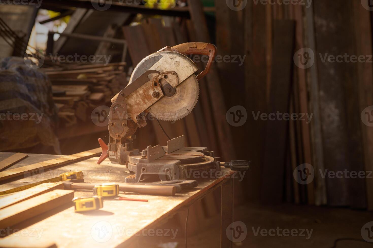 old wood workshop with saw machine workplace for furniture factory interior background photo