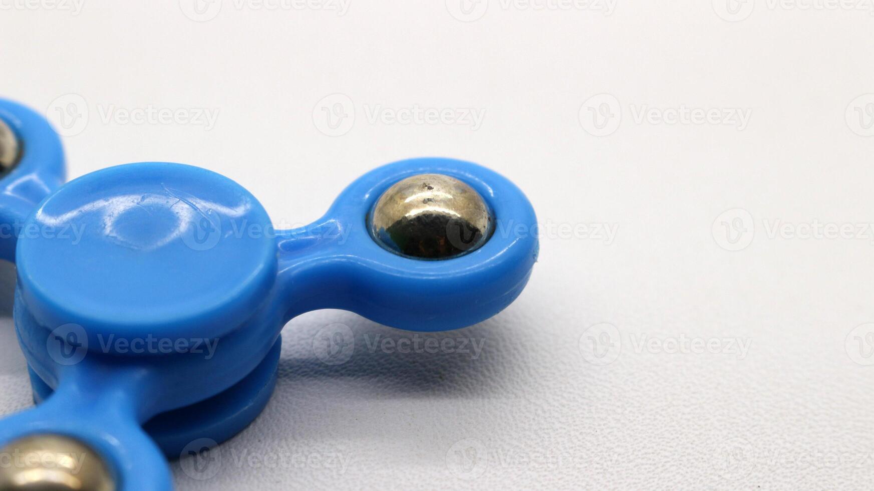 Blue fidget spinner isolated photo