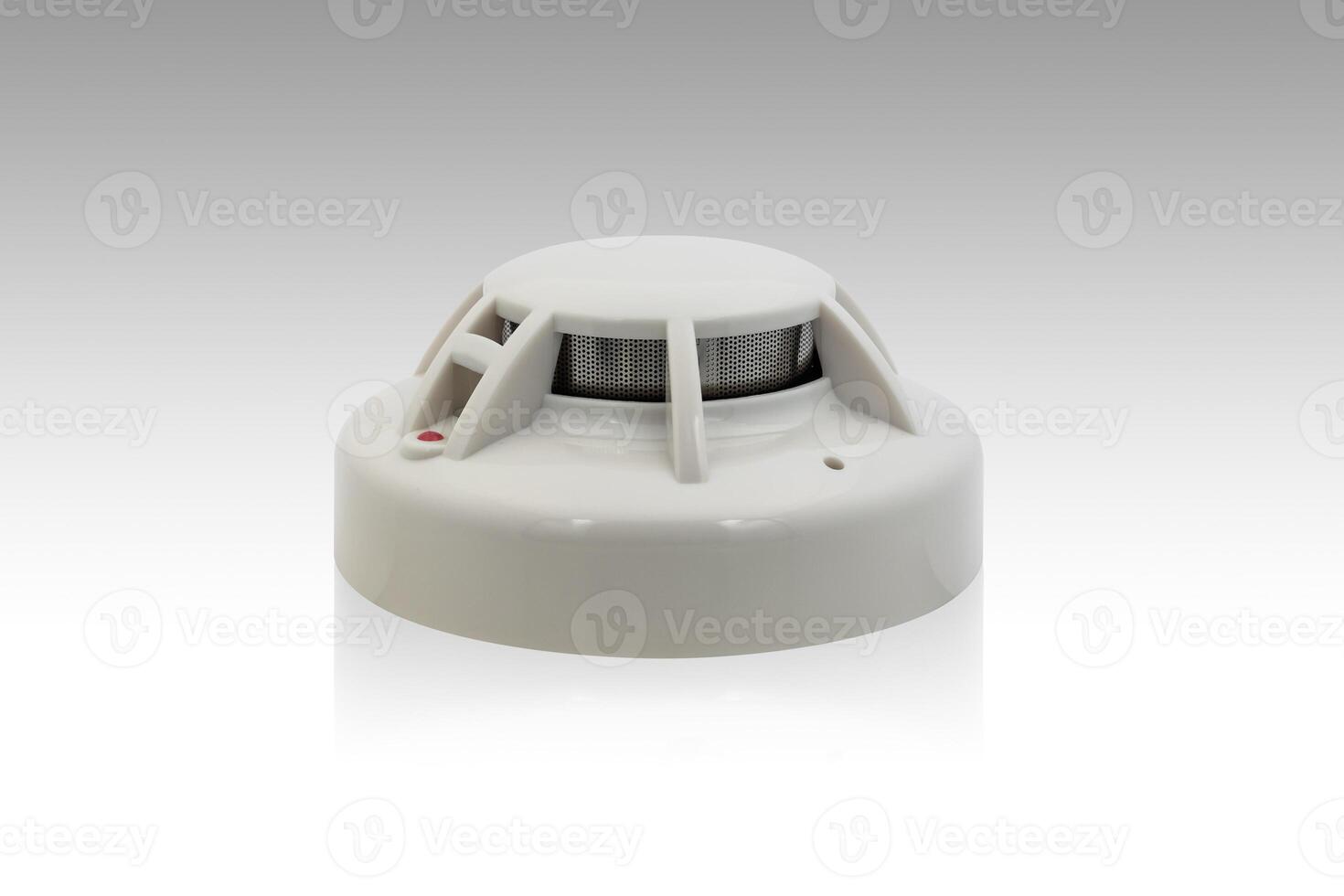 smoke detector or ceiling fire alarm detector home safety device isolated on white background with clipping path photo
