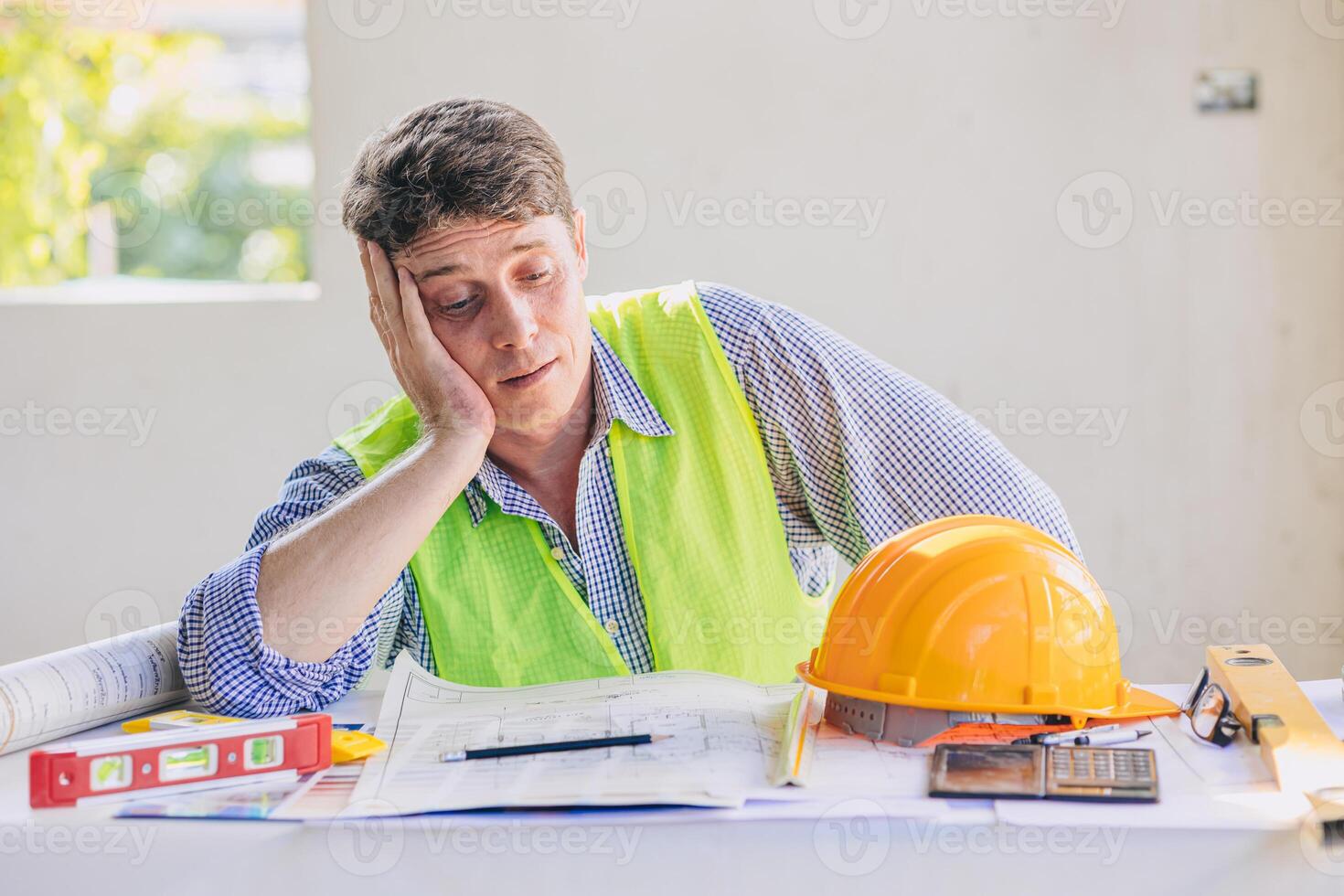 Construction engineers feel boring tired exhausted from overload hard working and building projects problem photo