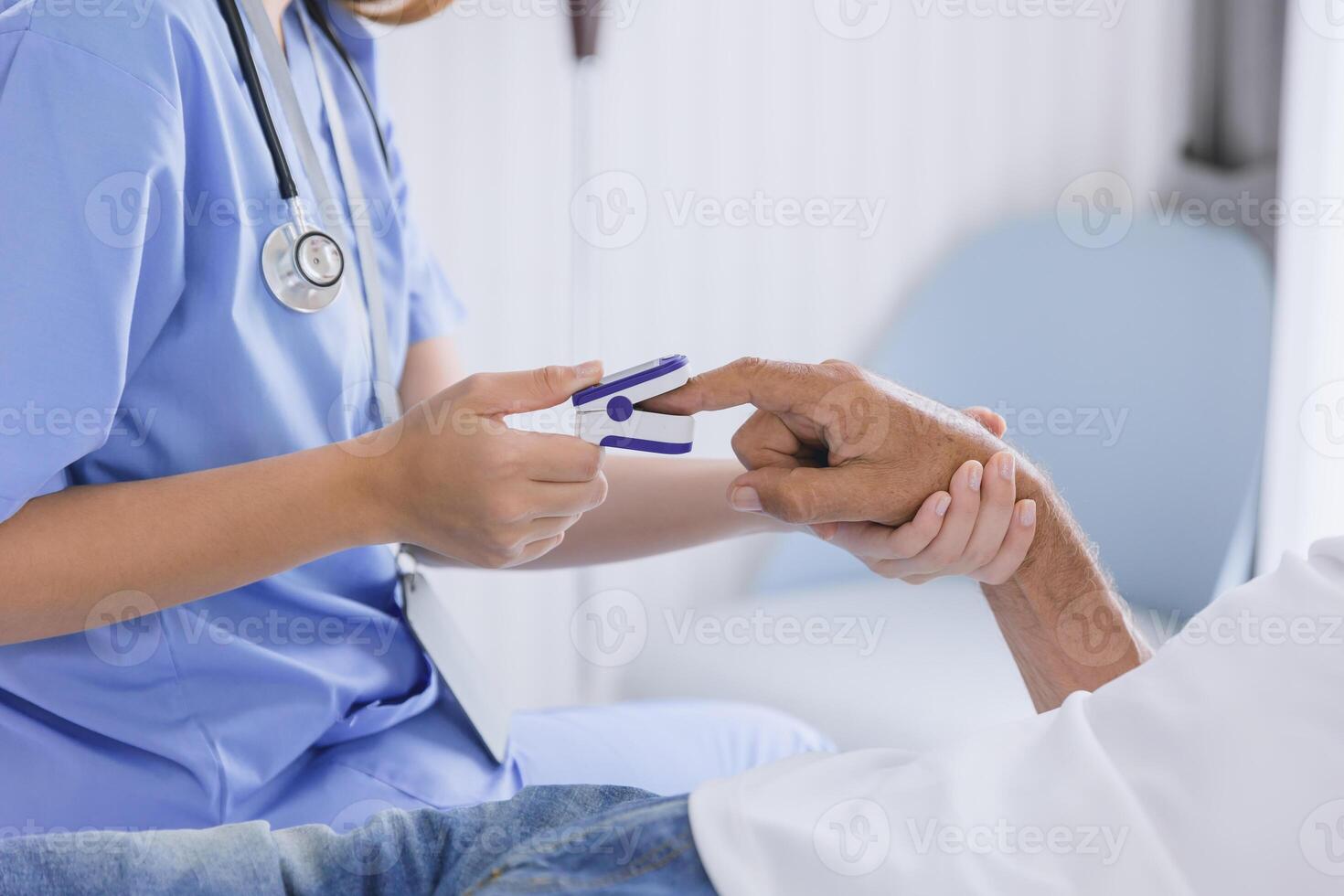 closeup nurse doctor using fingertip pause oximeter measures blood oxygen saturation level with patient photo