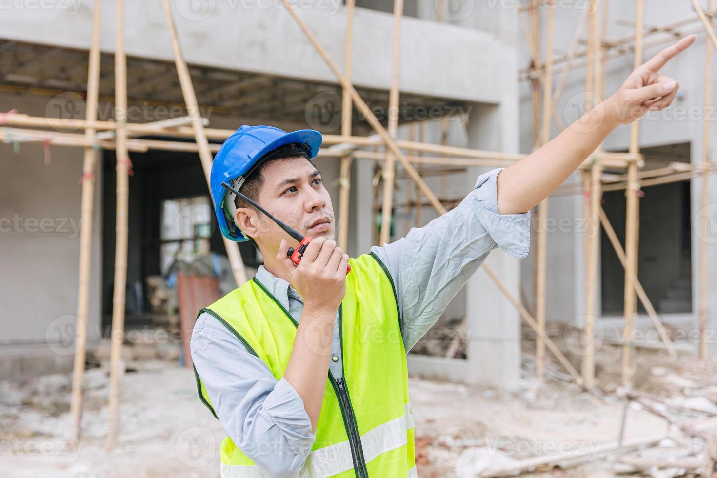 foreman engineer builder male worker intend to working hard at construction site home building project photo
