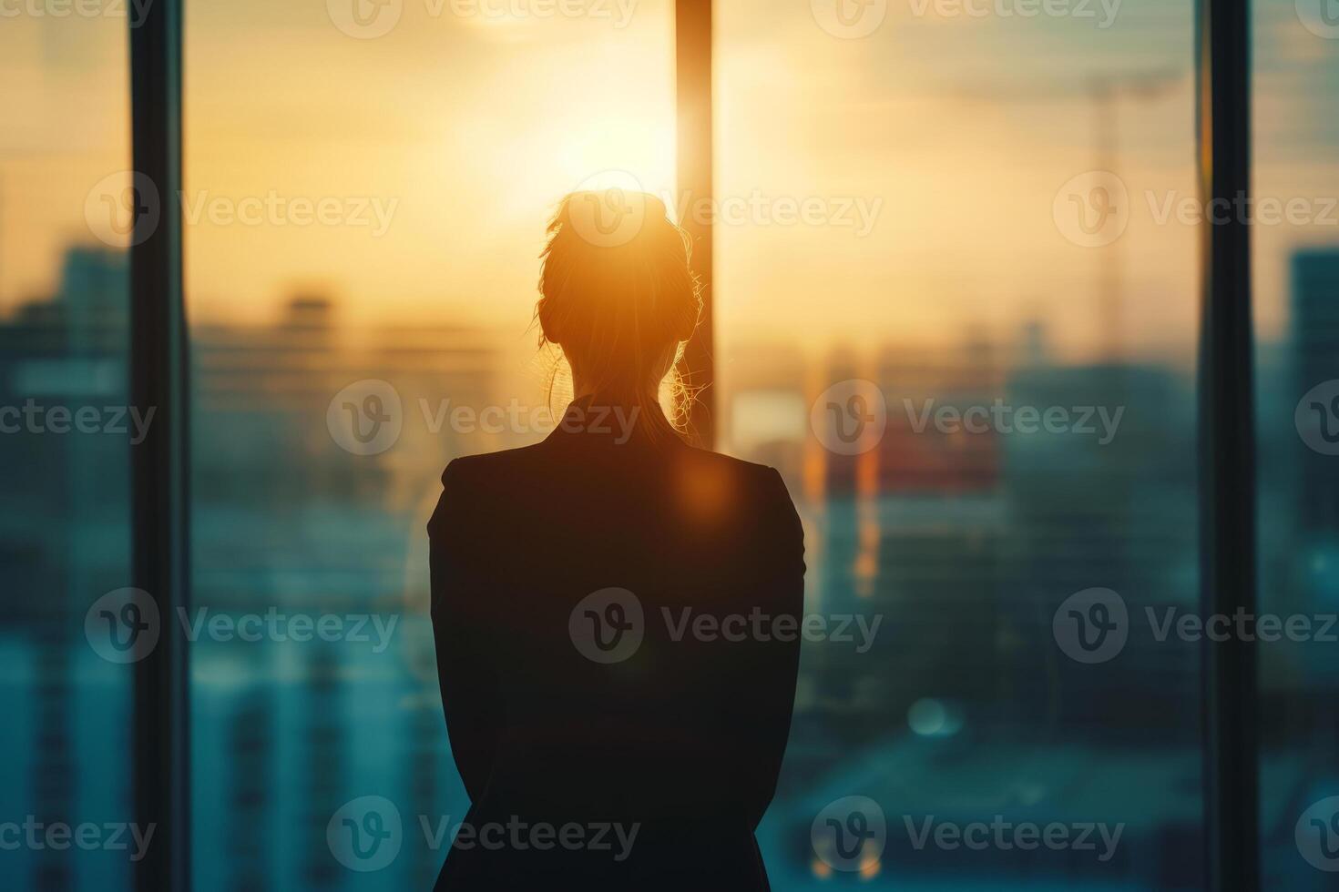 AI generated Back view of a a young businesswoman looks at a cityscape from an office window. Generative AI photo