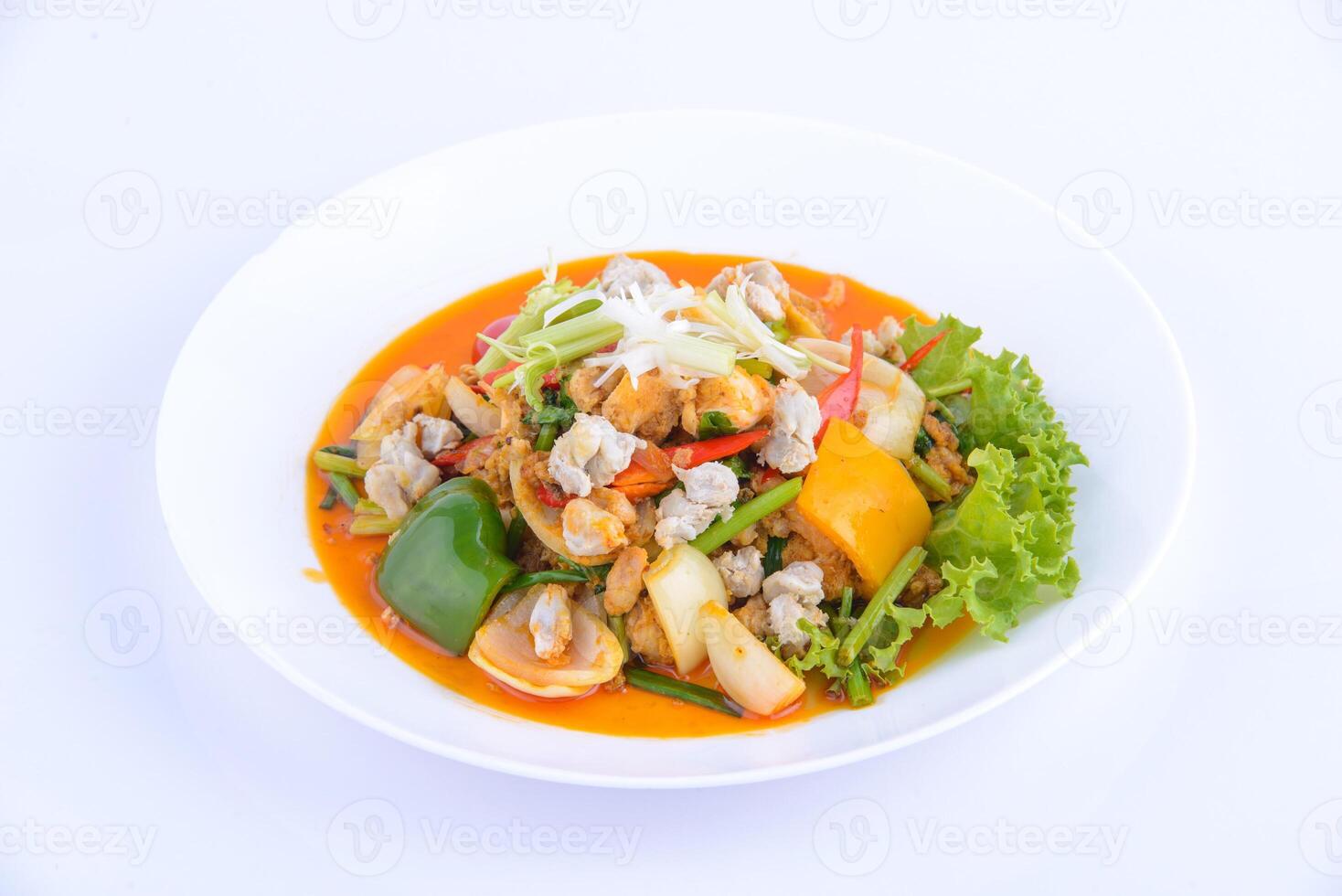 Thai favourite food. Stir Fried Squid with Curry on the white dish. photo