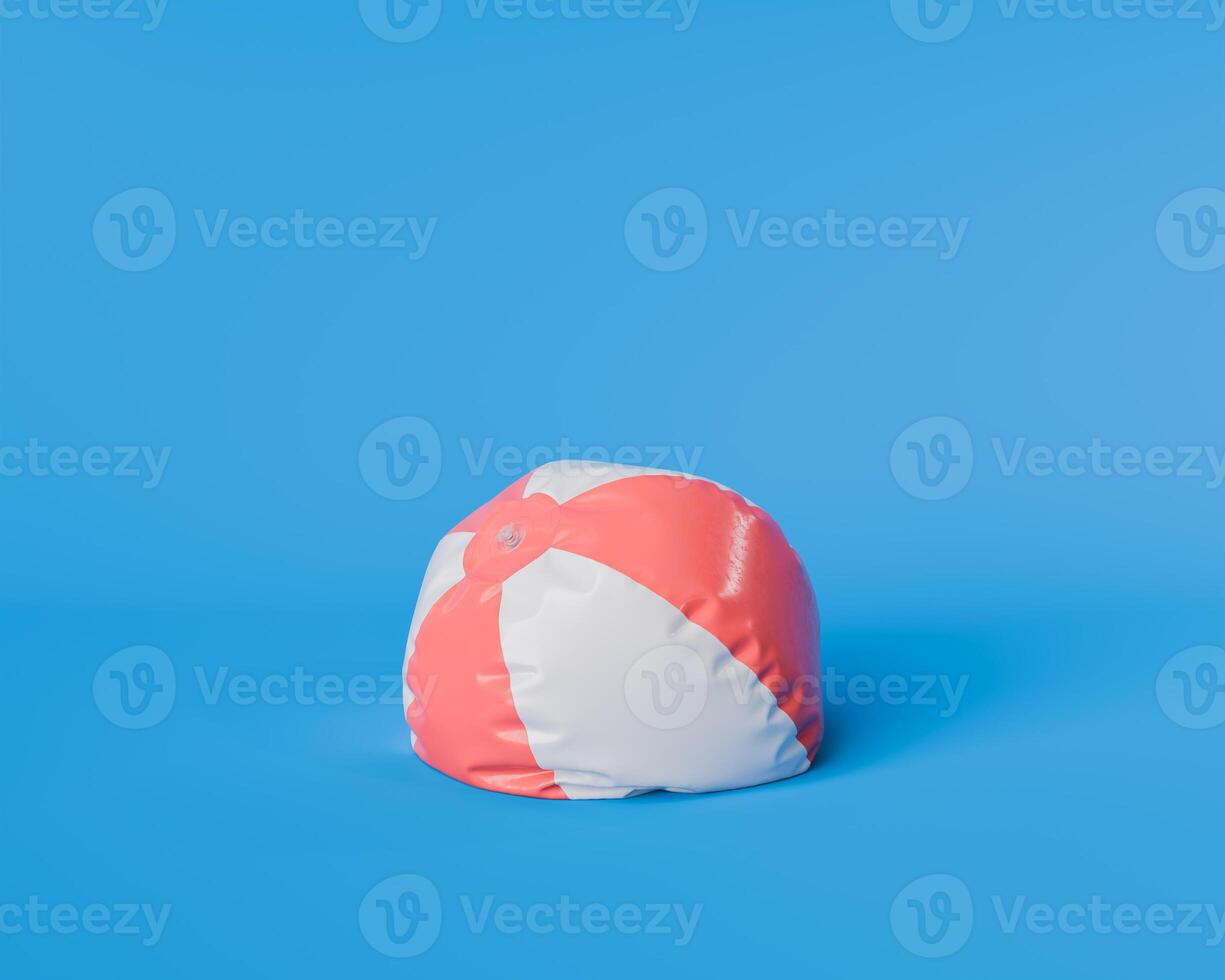 Deflated Red and White Beach Ball on Blue Background photo