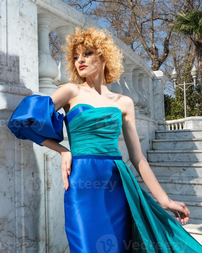 A woman in a blue dress photo