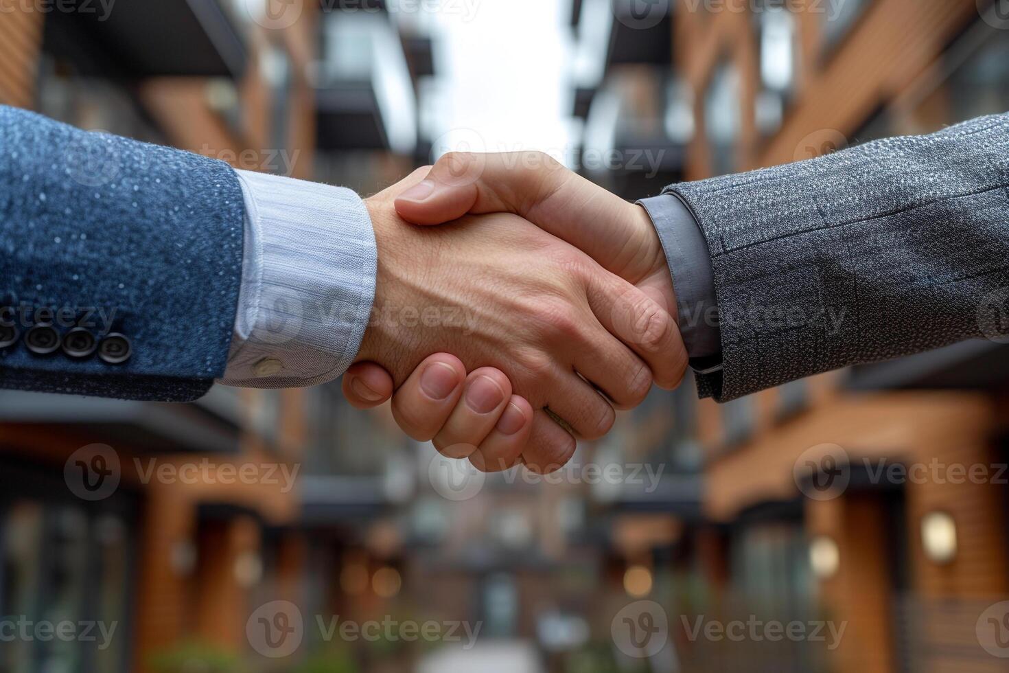 ai generado dos profesionales atractivo en un firma apretón de manos con oficina edificios en el fondo, representando un negocio acuerdo o camaradería. foto