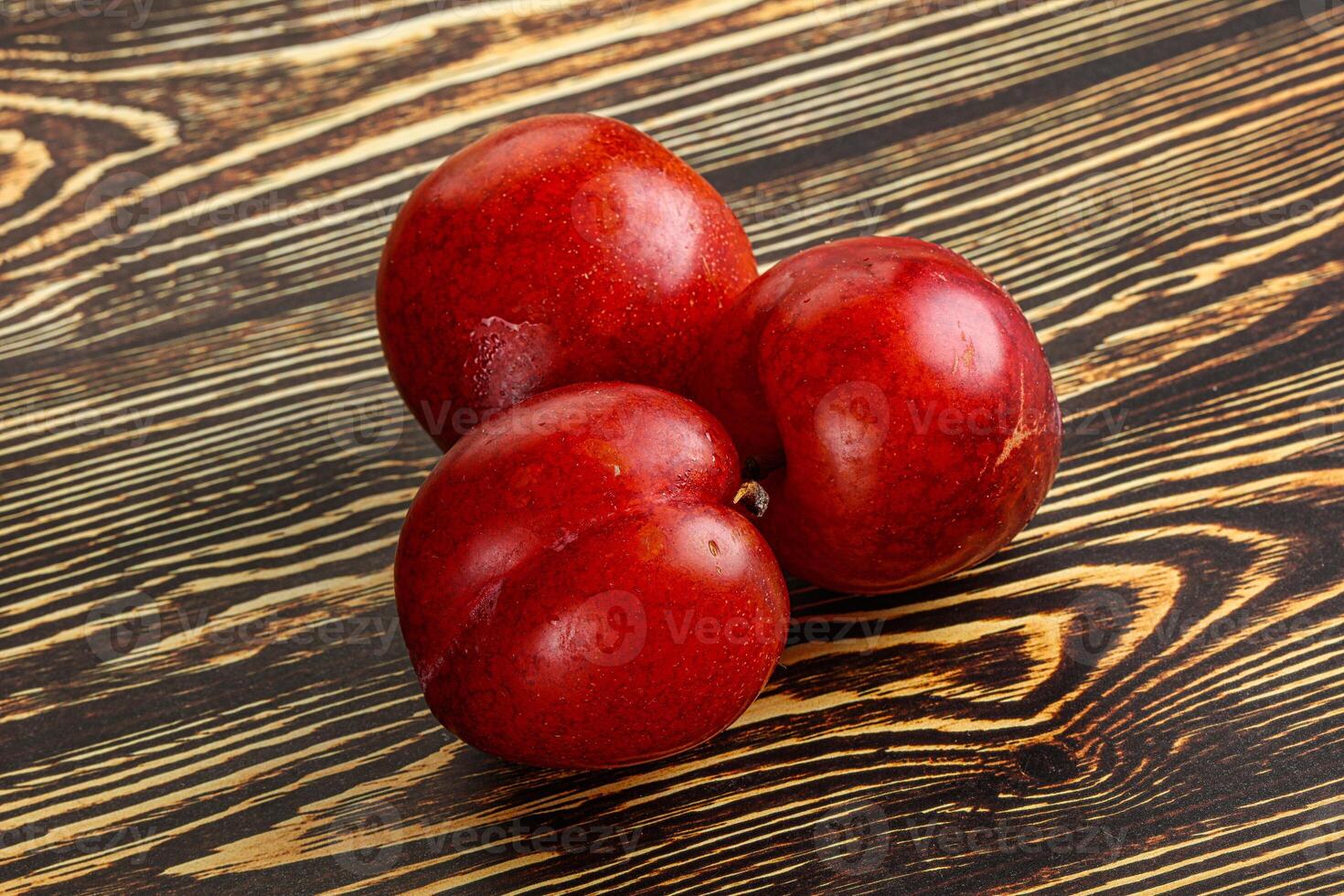 Ripe sweet juicy red plum photo