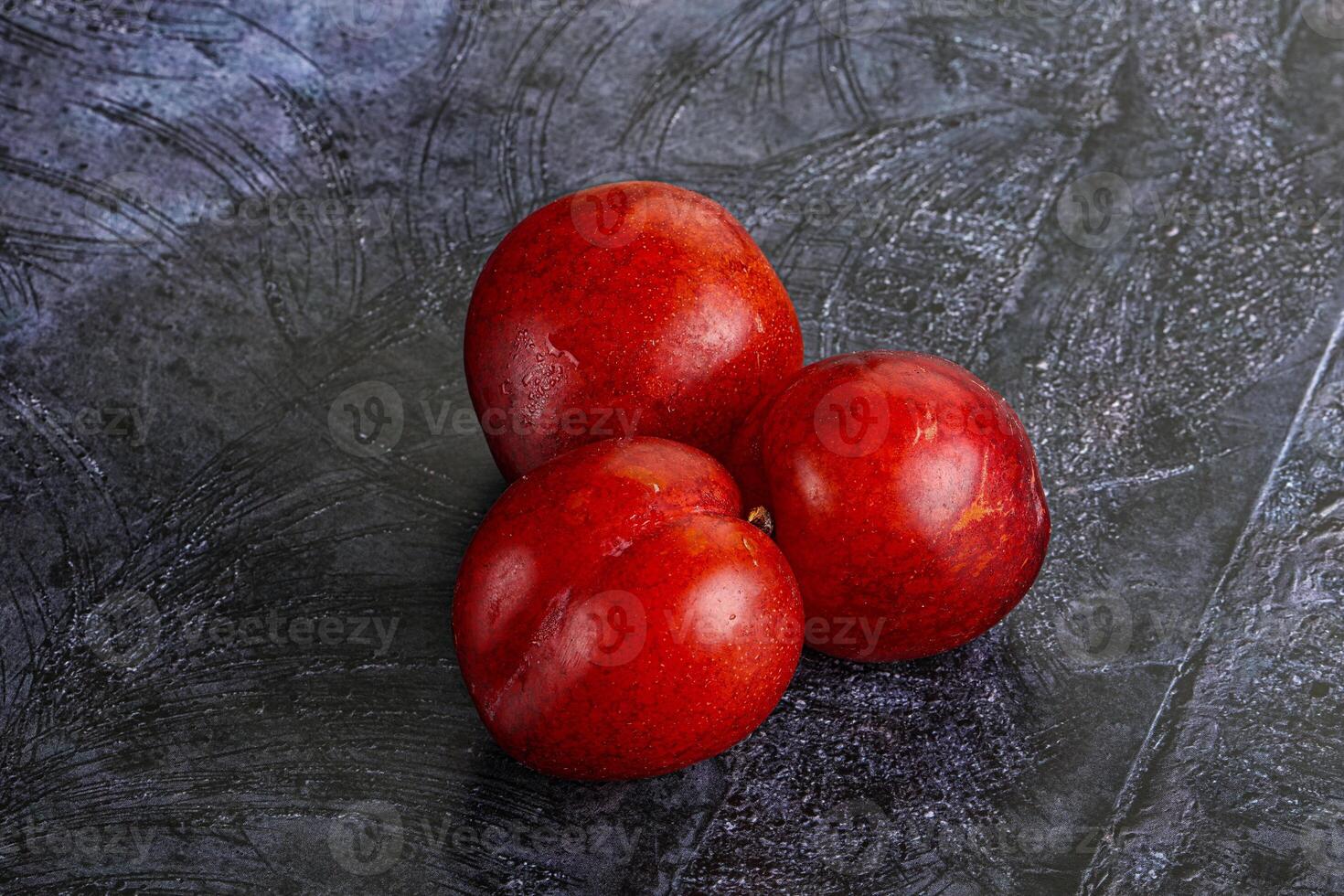 Ripe sweet juicy red plum photo