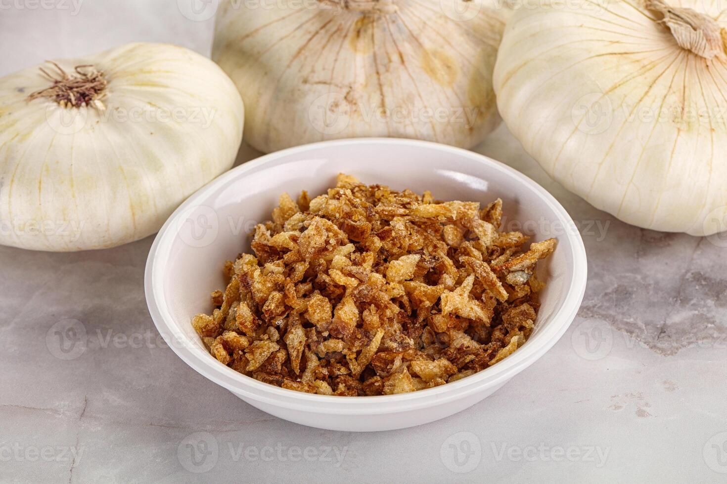 Dried roasted onion flakes for culinary photo