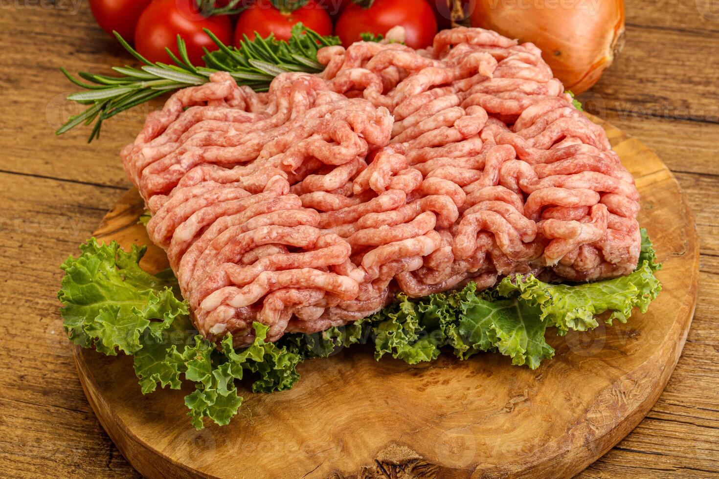 Raw pork minced meat over board photo