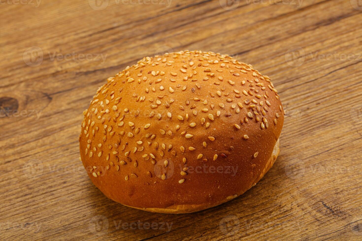 Burger bun with sesame seeds photo